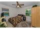 Bedroom with ceiling fan, natural light and a view of the pool at 1899 Oak Park S Dr, Clearwater, FL 33764