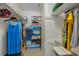 Walk-in closet features shelving for folded clothes, hanging rods, and neutral flooring at 1899 Oak Park S Dr, Clearwater, FL 33764