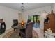 Dining area with views to the outdoor pool and patio at 1899 Oak Park S Dr, Clearwater, FL 33764