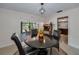 Dining area showcasing views to the pool and the Kitchen at 1899 Oak Park S Dr, Clearwater, FL 33764