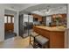 Modern kitchen features stainless steel appliances and a breakfast bar with seating at 1899 Oak Park S Dr, Clearwater, FL 33764