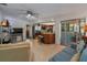 Open-concept living room with view of the kitchen and sliding doors to the lanai at 1899 Oak Park S Dr, Clearwater, FL 33764