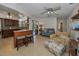Open-concept living area with kitchen view, barstool seating, and comfortable furniture at 1899 Oak Park S Dr, Clearwater, FL 33764