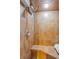Enclosed shower features orange tile surround, chrome shower head and fixtures at 1899 Oak Park S Dr, Clearwater, FL 33764
