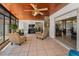 Spacious sunroom featuring tile floor, wood ceiling, many windows, and stylish furnishings at 1899 Oak Park S Dr, Clearwater, FL 33764
