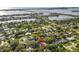 Aerial view of the property showcasing its lush surroundings and waterfront proximity at 208 Live Oak Ln, Largo, FL 33770