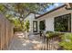 Charming patio area with planters, flowers, and white gravel at 208 Live Oak Ln, Largo, FL 33770