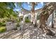 Backyard features a patio, landscaping, and a white gravel area at 208 Live Oak Ln, Largo, FL 33770