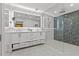 Modern bathroom features double vanity, expansive shower, and designer lighting at 208 Live Oak Ln, Largo, FL 33770