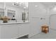 Modern bathroom features a marble topped vanity, an oversized mirror, and subway tile shower at 208 Live Oak Ln, Largo, FL 33770
