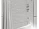 Bright bathroom shower with white subway tile and shower caddy at 208 Live Oak Ln, Largo, FL 33770