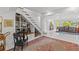 Stylish entryway features staircase, tile flooring, and arched doorways at 208 Live Oak Ln, Largo, FL 33770