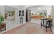 Bright foyer showcasing marble floors, arched doorways, and views of the living area and bedroom at 208 Live Oak Ln, Largo, FL 33770