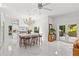 Spacious kitchen with a large island, barstool seating, and stylish pendant lighting, perfect for gatherings at 208 Live Oak Ln, Largo, FL 33770