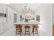 Bright kitchen island with seating, modern appliances, and plenty of counter space, perfect for entertaining at 208 Live Oak Ln, Largo, FL 33770