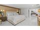Comfortable main bedroom with a feature wall, plush bedding, and serene ambiance at 208 Live Oak Ln, Largo, FL 33770