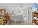 Serene main bedroom with white walls, ceiling fan, and sliding glass doors at 208 Live Oak Ln, Largo, FL 33770