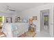 Bright and airy main bedroom leads to en-suite bathroom and additional bedrooms at 208 Live Oak Ln, Largo, FL 33770