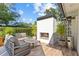 Cozy outdoor lounge area with a modern fireplace perfect for relaxing and entertaining at 208 Live Oak Ln, Largo, FL 33770