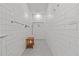 Bright shower features white subway tile and a small wood bench at 208 Live Oak Ln, Largo, FL 33770