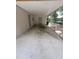 Carport featuring a concrete floor and access doors at 21352 Lehouier Dr, Brooksville, FL 34601