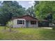 Charming single story home with lush green lawn and inviting curb appeal at 21352 Lehouier Dr, Brooksville, FL 34601