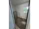 Small laundry room with a water heater, and space for a washer and dryer at 21352 Lehouier Dr, Brooksville, FL 34601