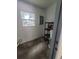 Small storage room featuring shelving, a window and an electrical panel at 21352 Lehouier Dr, Brooksville, FL 34601