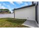 A view of the backyard with a privacy fence and stepping stones at 2328 W La Salle St, Tampa, FL 33607