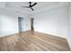 Spacious primary bedroom with tray ceilings, neutral walls, and wood-look floors at 2328 W La Salle St, Tampa, FL 33607
