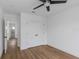 Bright bedroom with wood-look floors, ceiling fan and large closet with double doors at 2328 W La Salle St, Tampa, FL 33607