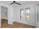 Bright bedroom features wood floors, a ceiling fan, and modern windows at 2328 W La Salle St, Tampa, FL 33607