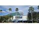 The Florida Aquarium, showcasing a unique architectural design with palm trees and blue skies at 2328 W La Salle St, Tampa, FL 33607