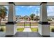 Inviting front porch view with brick support columns and black wrought iron fence at 2328 W La Salle St, Tampa, FL 33607