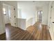 Bright hallway with wood-look flooring, leading to bedrooms and a bathroom at 2328 W La Salle St, Tampa, FL 33607