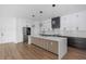 Modern kitchen with a waterfall island, stainless steel appliances, and decorative cube pendant lighting at 2328 W La Salle St, Tampa, FL 33607