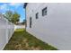 A view of the side yard with privacy fence and modern windows at 2328 W La Salle St, Tampa, FL 33607