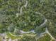 Aerial view featuring winding walking trails through lush green landscaping at 2459 Parkstream Ave, Clearwater, FL 33759