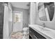 This bathroom features a single vanity, modern fixtures, and a glass-enclosed shower at 2459 Parkstream Ave, Clearwater, FL 33759