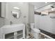 This bathroom features a modern vanity, a glass-enclosed shower, and decorative tile at 2459 Parkstream Ave, Clearwater, FL 33759