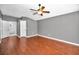 Large bedroom with hardwood floors and ensuite bathroom and closet at 2459 Parkstream Ave, Clearwater, FL 33759