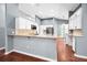 Modern kitchen with white cabinets, granite countertops, and stainless steel appliances at 2459 Parkstream Ave, Clearwater, FL 33759