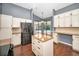 Well-appointed kitchen featuring an island, granite countertops, and stainless steel appliances at 2459 Parkstream Ave, Clearwater, FL 33759