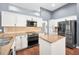 Beautiful kitchen with white cabinetry, stainless appliances, and a convenient center island at 2459 Parkstream Ave, Clearwater, FL 33759