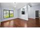 Open-concept living room with lots of natural light and wood floors at 2459 Parkstream Ave, Clearwater, FL 33759