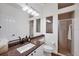 Modern bathroom featuring a granite countertop, recessed lighting, and a glass-enclosed shower at 2518 Dick Wilson Dr, Sarasota, FL 34240