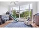 Bright bedroom with a large window, play area and comfortable recliner at 2518 Dick Wilson Dr, Sarasota, FL 34240