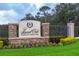 Community sign for Laurel Oak Estates & Country Club featuring a stone base and manicured landscaping at 2518 Dick Wilson Dr, Sarasota, FL 34240