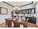 Elegant dining room with a chandelier and built-in storage, perfect for entertaining guests at 2518 Dick Wilson Dr, Sarasota, FL 34240