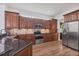 Modern kitchen with granite countertops, stainless steel appliances, and custom cabinetry at 2518 Dick Wilson Dr, Sarasota, FL 34240